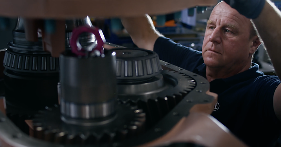 Employee working on part in workshop