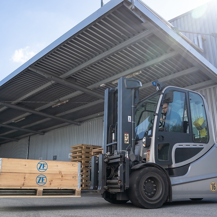 Forklift transporting original parts