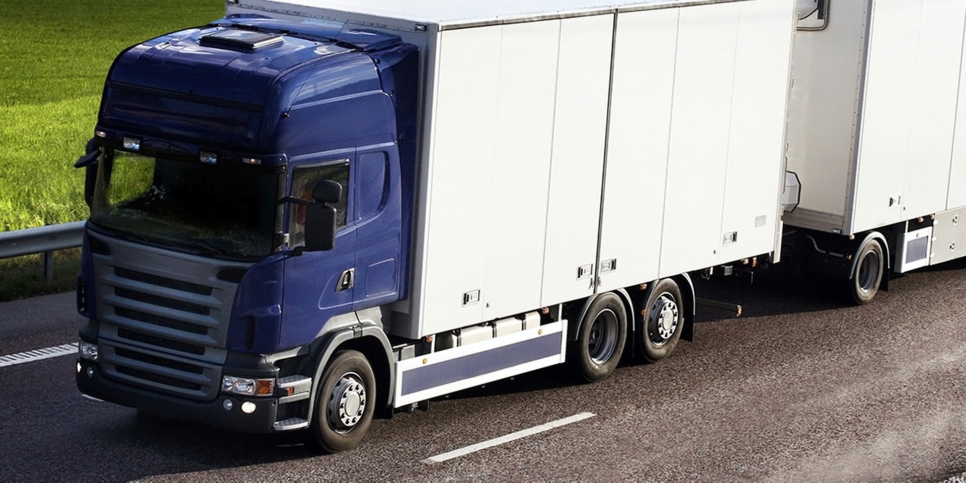 truck blue and white on the road 