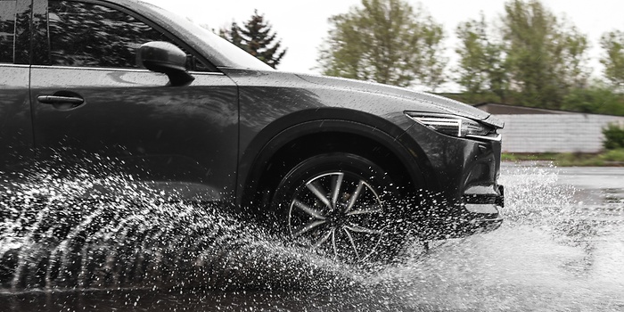 wheels splashing trough water